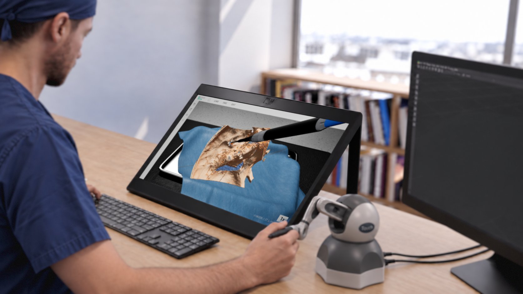 A surgeon in scrubs dissects a patient-specific temporal bone model with a haptic device beside a spatial reality display